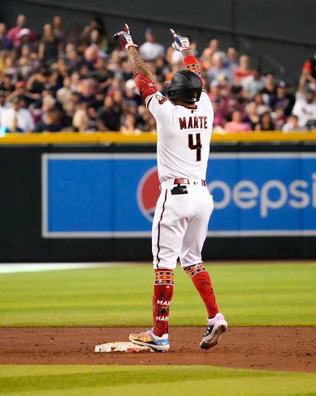 Jul 4, 2022; Phoenix, Arizona, USA; Arizona Diamondbacks designated hitter Ketel Marte (4) reacts after hitting an RBI-ground rule double against the San Francisco Giants in the second inning at Chase Field.

Mlb Giants At Diamondbacks